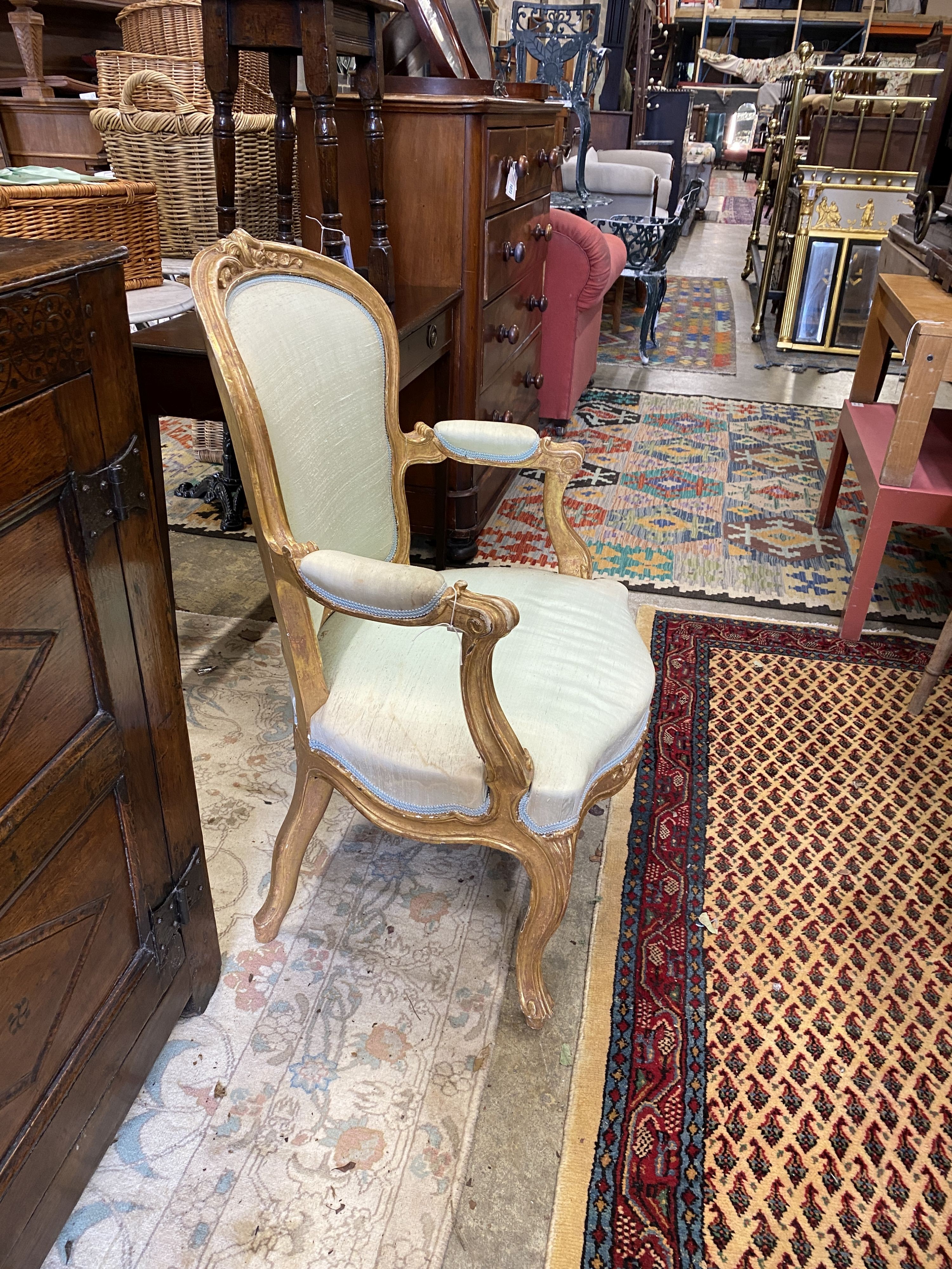 A pair of 19th century Louis XV design carved giltwood fauteuils, width 64cm, depth 50cm, height 94cm